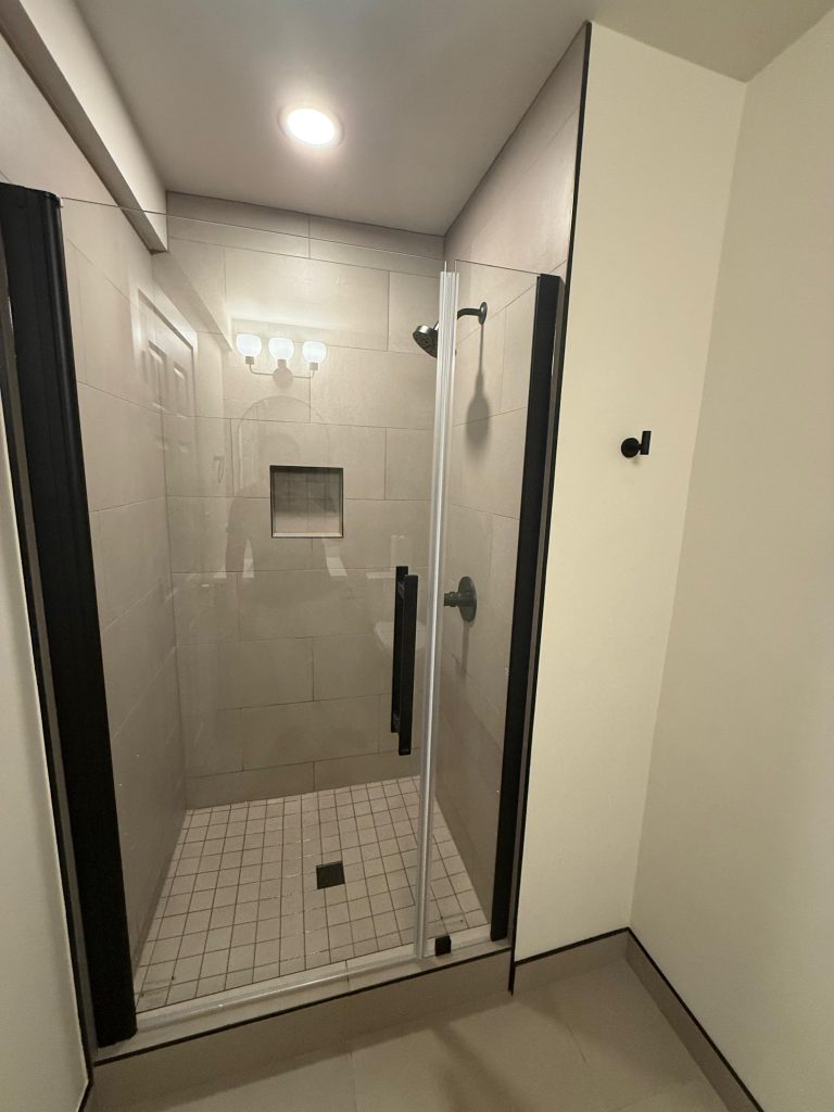 Finished bathroom remodel detail photo showing updated fixtures and finishes